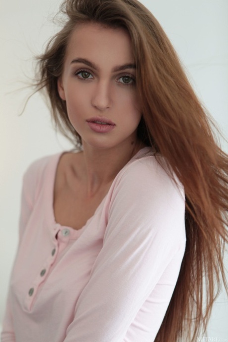 Glamorous teen Holly Haim strips and reveals her long legs and perky tits
