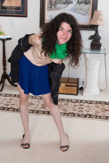 Curly haired amateur Silki Smith shows off her natural tits & her hairy pussy