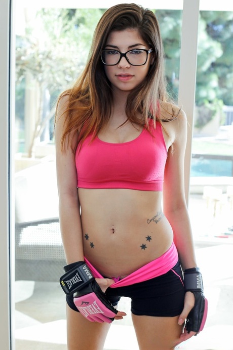 Sporty glasses clad teen Ava Taylor flashes her pretty shaved pussy & tiny ass