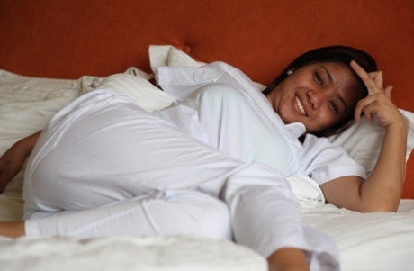 Sexy young filipina nurse Joanna doffs uniform pants to show her trimmed pussy
