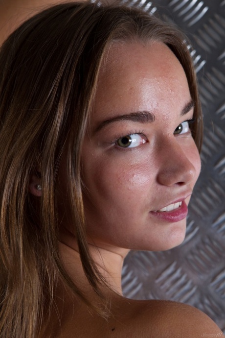 Teen Alice D takes off lingerie and poses nude being surrounded with metal