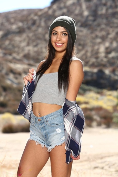 Gorgeous teen Taylor May shows her slim body and small melons outdoors