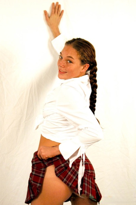 Pigtailed & freckled cutie Ashley Gracie flashes hot ass in schoolgirl outfit