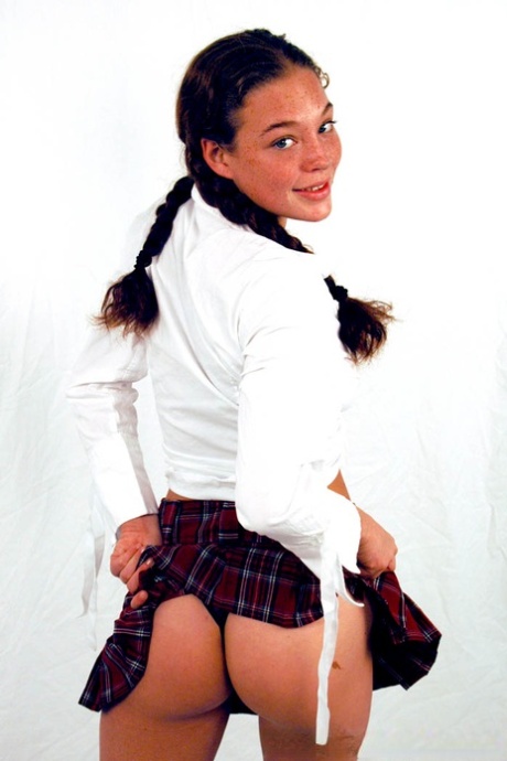 Pigtailed & freckled cutie Ashley Gracie flashes hot ass in schoolgirl outfit