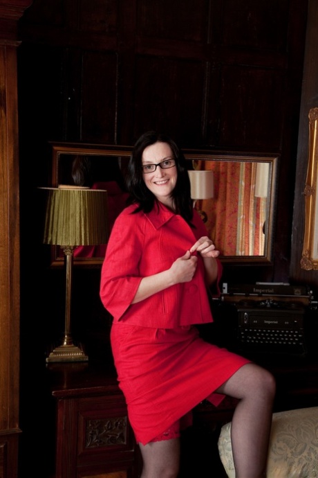 Nerdy babe in red Emily Marshall fingering her hairy cunt on the couch