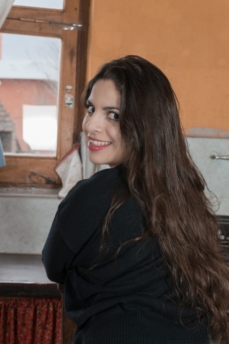 Busty Latina Anastasia Cherry strips to black boots and rubs her fuzzy beaver