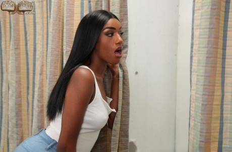 Ebony with nice breasts Ashley Aleigh takes a gloryhole boner from behind
