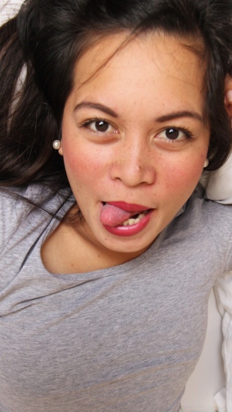 Brunette Filipina babe Mercy strips and flaunts her hairy pussy