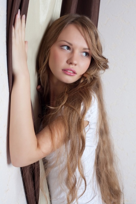 Sweet teen with an amazing butt Virginia Sun undresses and poses nude