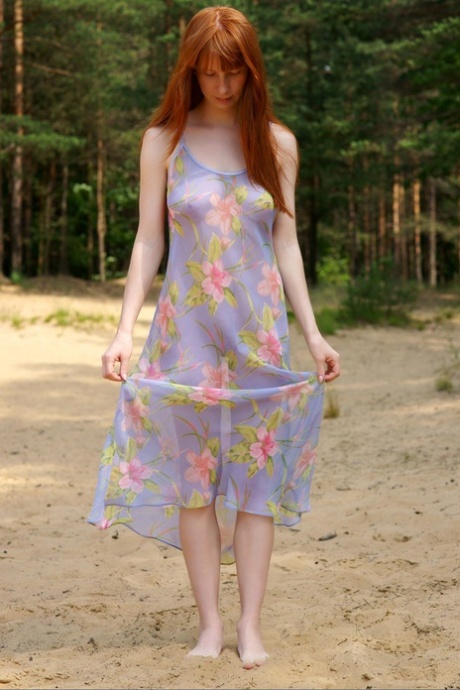 Redheaded model Alexana strips her dress & shows her big tits & hairy muff
