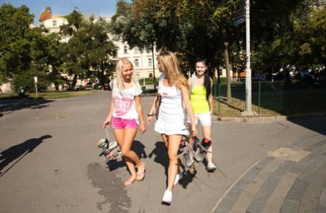 Four sweet teens expose their skinny bodies and small tits on roller blades