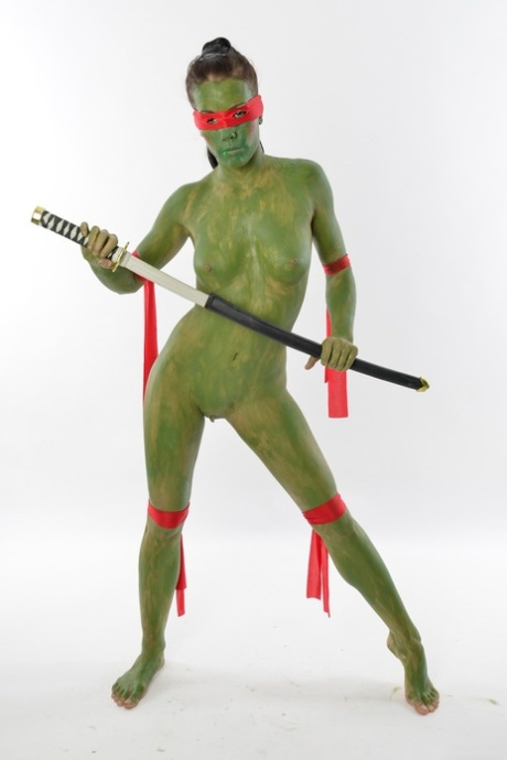 Green samurai Shana Lane posing and showing off her big booty in a solo