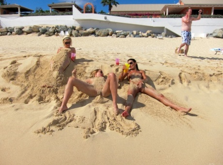 Blonde lesbian Bibi Noel & her slutty GFs fool around while naked at the beach