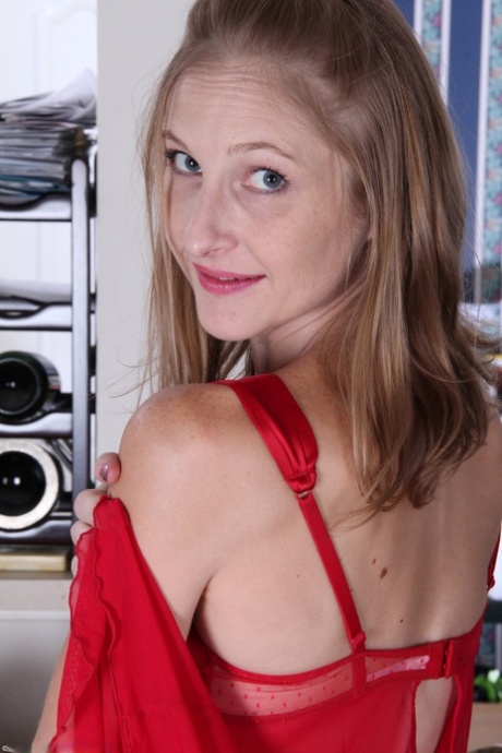Kinky skinny mature Beyla removes her red outfit and spreads her pussy