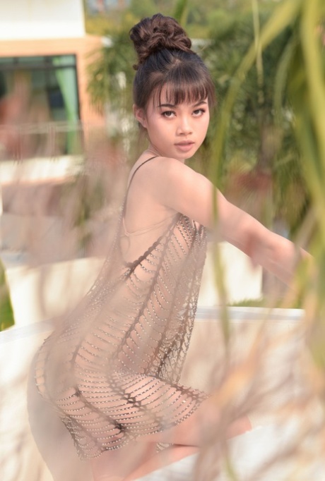 Adorable teen Sowan unveils her small titties and cute small cunt outdoors