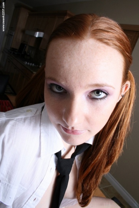Ponytailed schoolgirl Gypsy shows her shaved pink pussy up close
