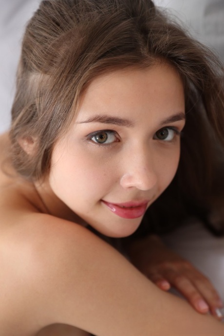 Lovely Ukrainian babe Mila Azul teases with her beautiful big tits on her bed