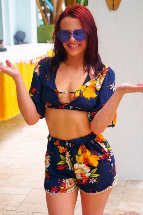 Hot ginger with a big ass Maria strips and poses while dancing around a pole