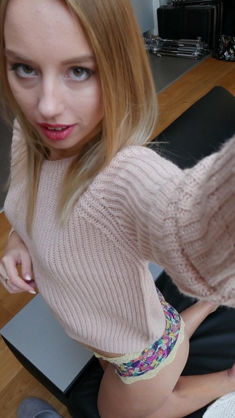 Cute teen Kira Thorn teases with her bum and swollen muff in solo action