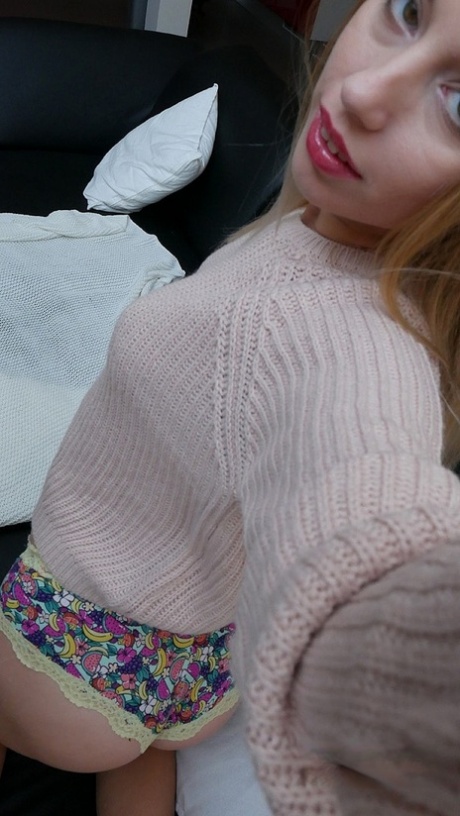 Cute teen Kira Thorn teases with her bum and swollen muff in solo action