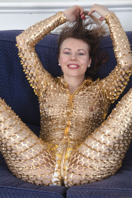 Amateur mature Alexia Allen doffs her golden outfit & reveals her hairy pussy