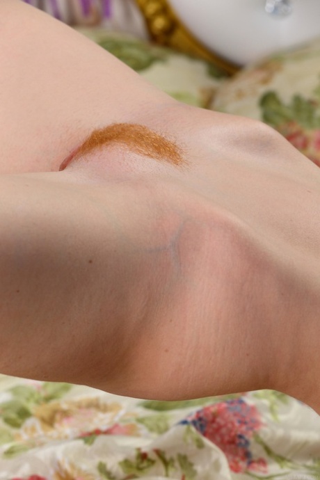 Long-haired ginger Brisa A strips  teases with her long legs  sexy holes