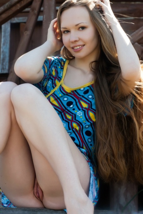 Sweet teen Virginia Sun unveils her yummy pussy and poses outdoors