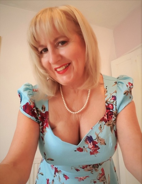 Naughty British woman Lorna Blu shows off her big ass and her big tits