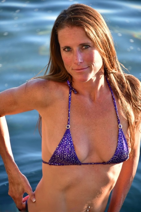 Tall MILF Sofie Marie flaunts her big ass wearing a sexy bikini outdoors