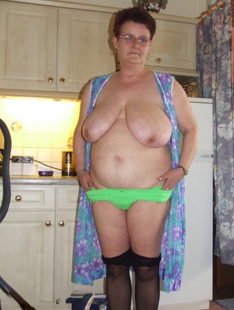 Old grandma Ingeborg exposes her fat body and sticks a vacuum pipe in her twat