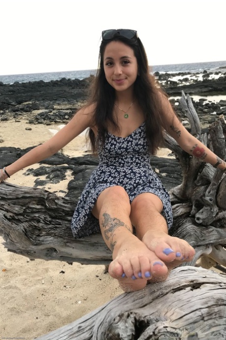 Teen Mi Ha Doan flashes her tits and exposes her hairy pussy on the beach
