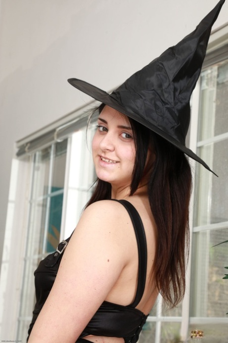 Amateur teen in a witch hat Leda Lotharia flaunts her ass and twat