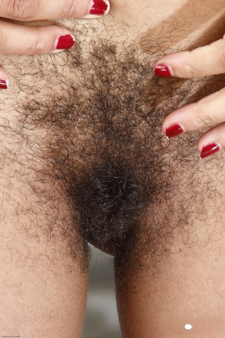 Afro-American cougar Oya flaunts her fuzzy snatch and big breasts outdoors