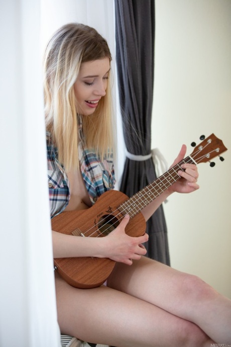 Beautiful blue eyed babe with ukulele Freya Mayer strips and poses nude