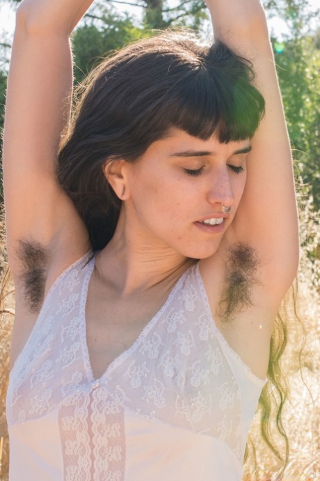 Amateur teen with hairy armpits Bella Mae spreads her bushy pussy outdoors