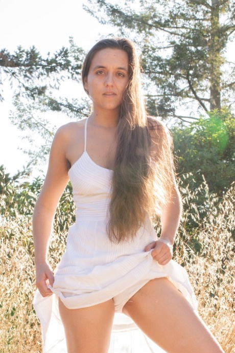 American amateur Zse Zse Lamarr unveils her saggy tits & furry pussy in nature