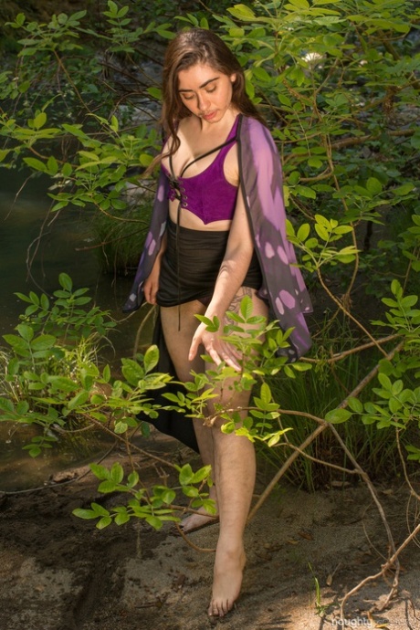 Amateur girl with natural boobs Kisa Fae undresses and flaunts her bush