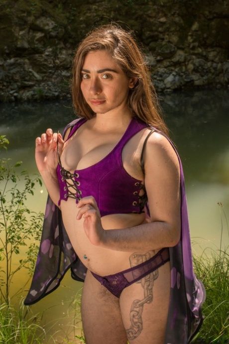 Amateur girl with natural boobs Kisa Fae undresses and flaunts her bush