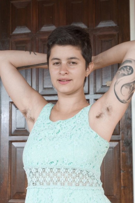 Short haired babe Sue removes her dress and exposes big tits and her bush