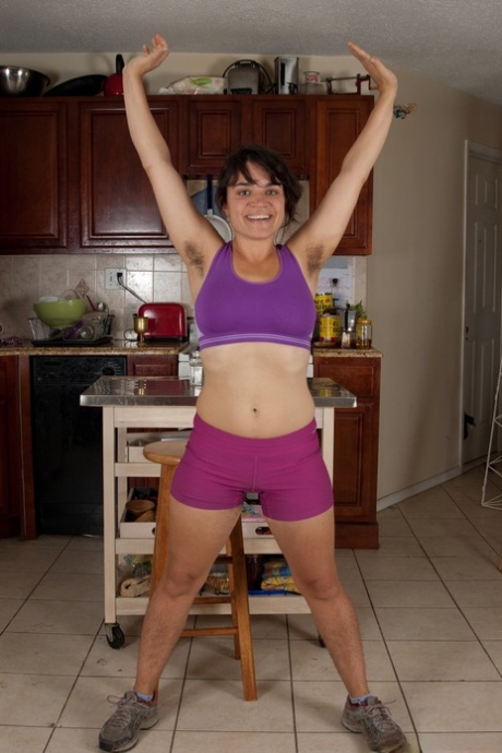 Fit brunette Hickory takes off her workout outfit to show her hairy pussy