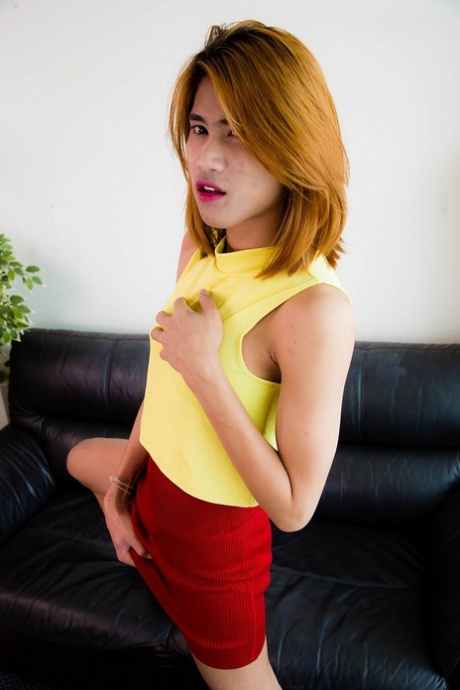 Redheaded Asian shemale Pam spreads her big ass cheeks & wanks her big dick