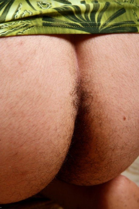 Chubby MILF Marie shows off her very hairy pussy up close outdoors