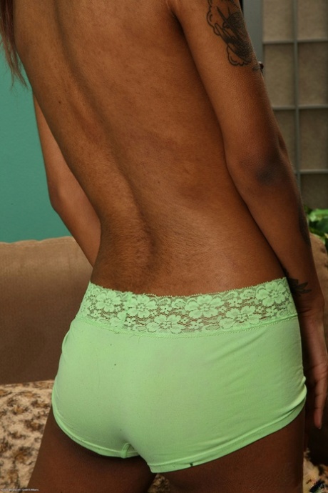 Petite ebony teen Yvette doffs her green undies and poses naked