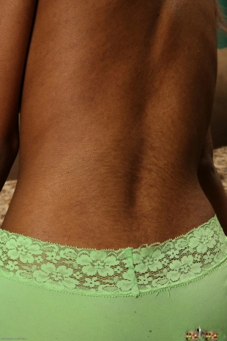 Petite ebony teen Yvette doffs her green undies and poses naked