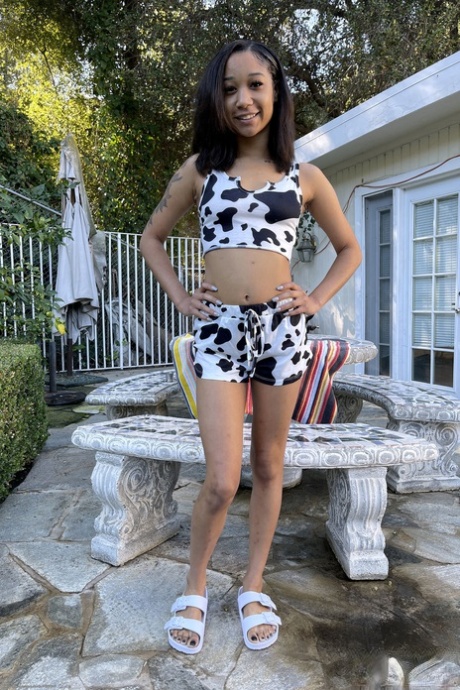 Tiny ebony teen Alicia Reign shows her firm ass & holes up close