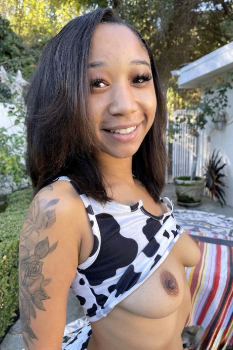 Tiny ebony teen Alicia Reign shows her firm ass & holes up close