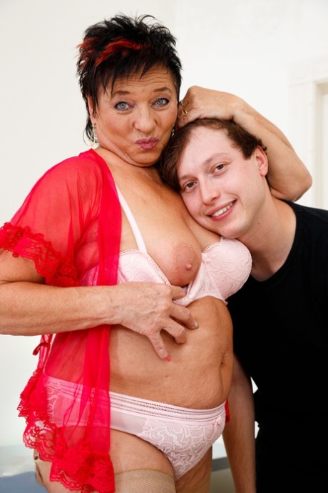 Chubby granny Joanne comforts a young boy and makes him bang her pussy