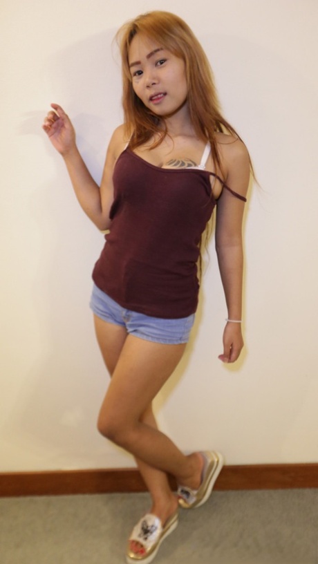 Asian hottie Aom V shows off her inked body and gets a good POV pounding