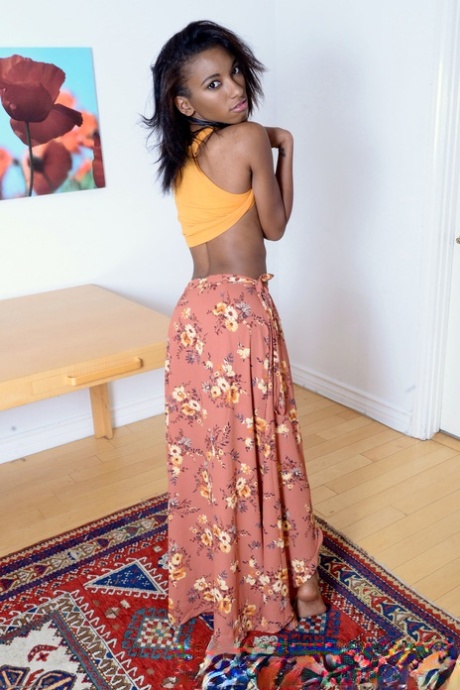 Sexy ebony teen Raven Wylde unveils her skinny body and chocolate holes