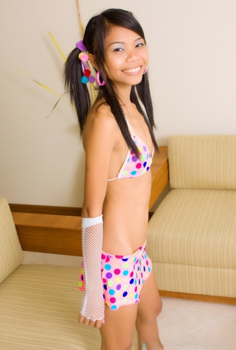 Skinny Asian girl Min unveils her bald pussy in a sexy lingerie striptease